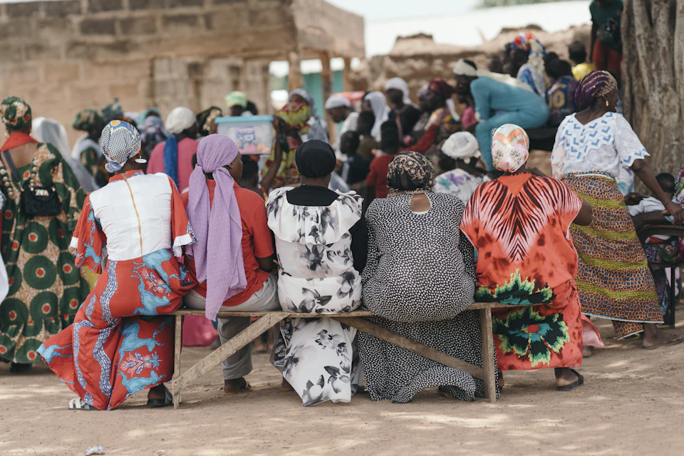 A community meeting in the shade