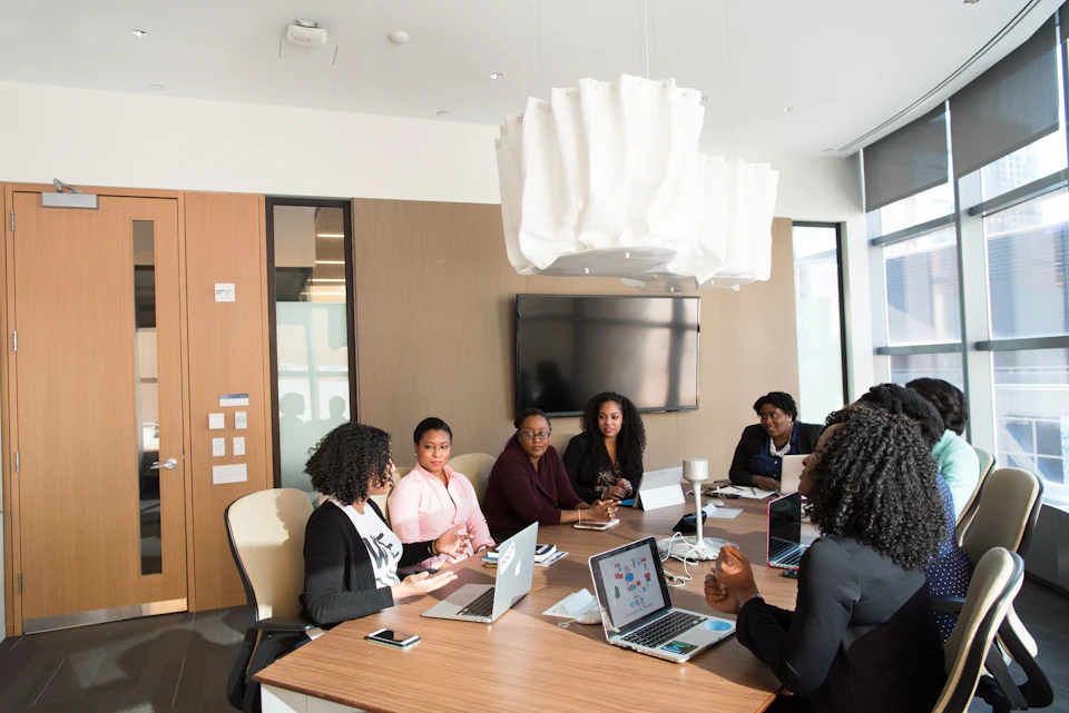 An executive team meeting in a bright conference room