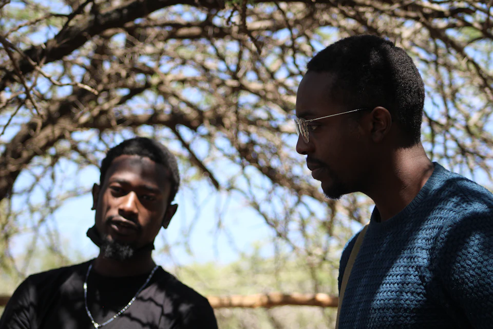 Two men in conversation outdoors