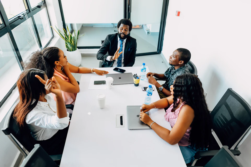 Colleagues around a table in a strategy session